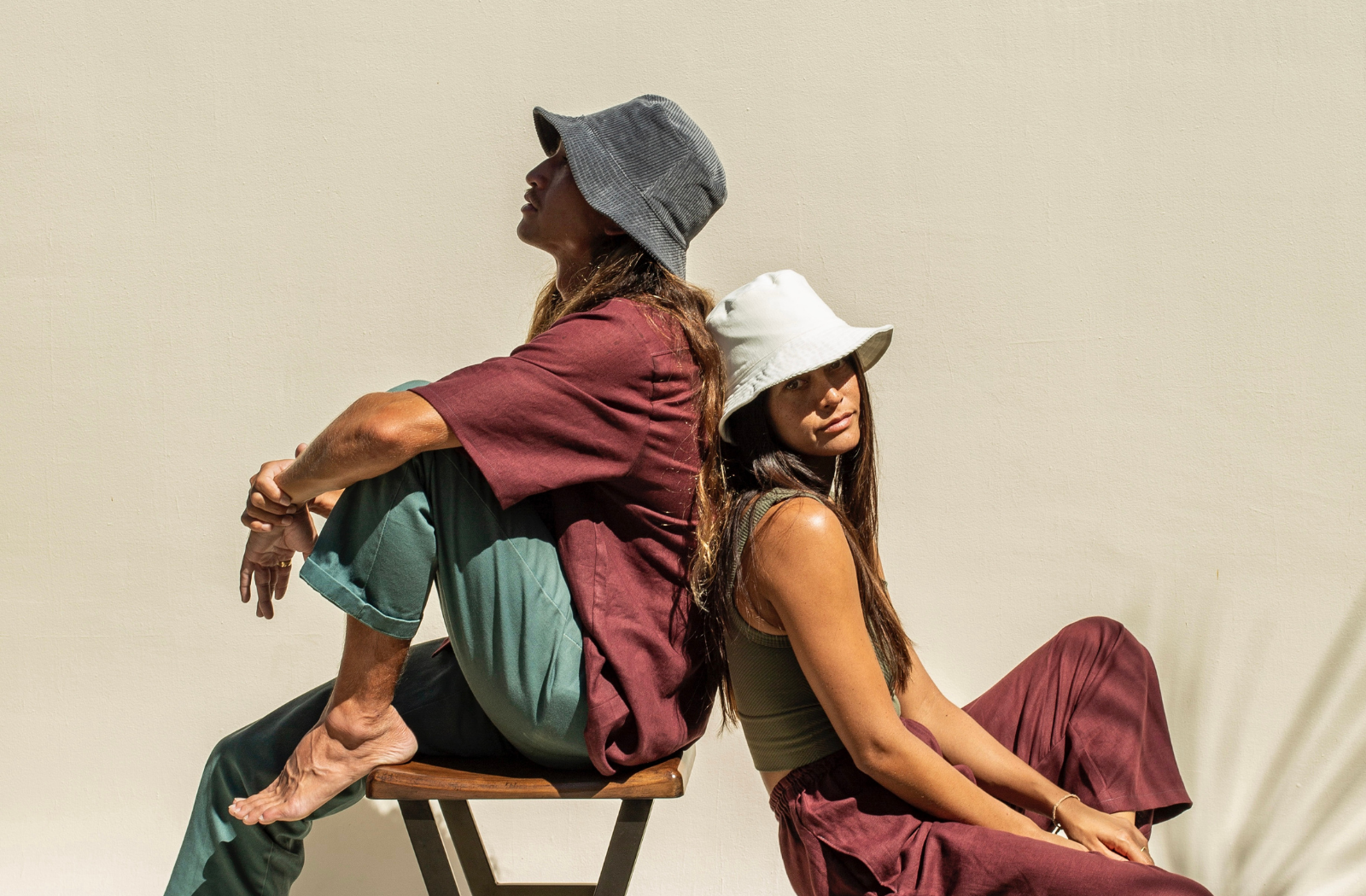 Guy and girl wearing unisex bucket hat in blue and white corduroy.